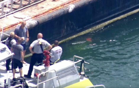 Coast Guard begins salvage operation and investigates cause of boat collision that killed two girls